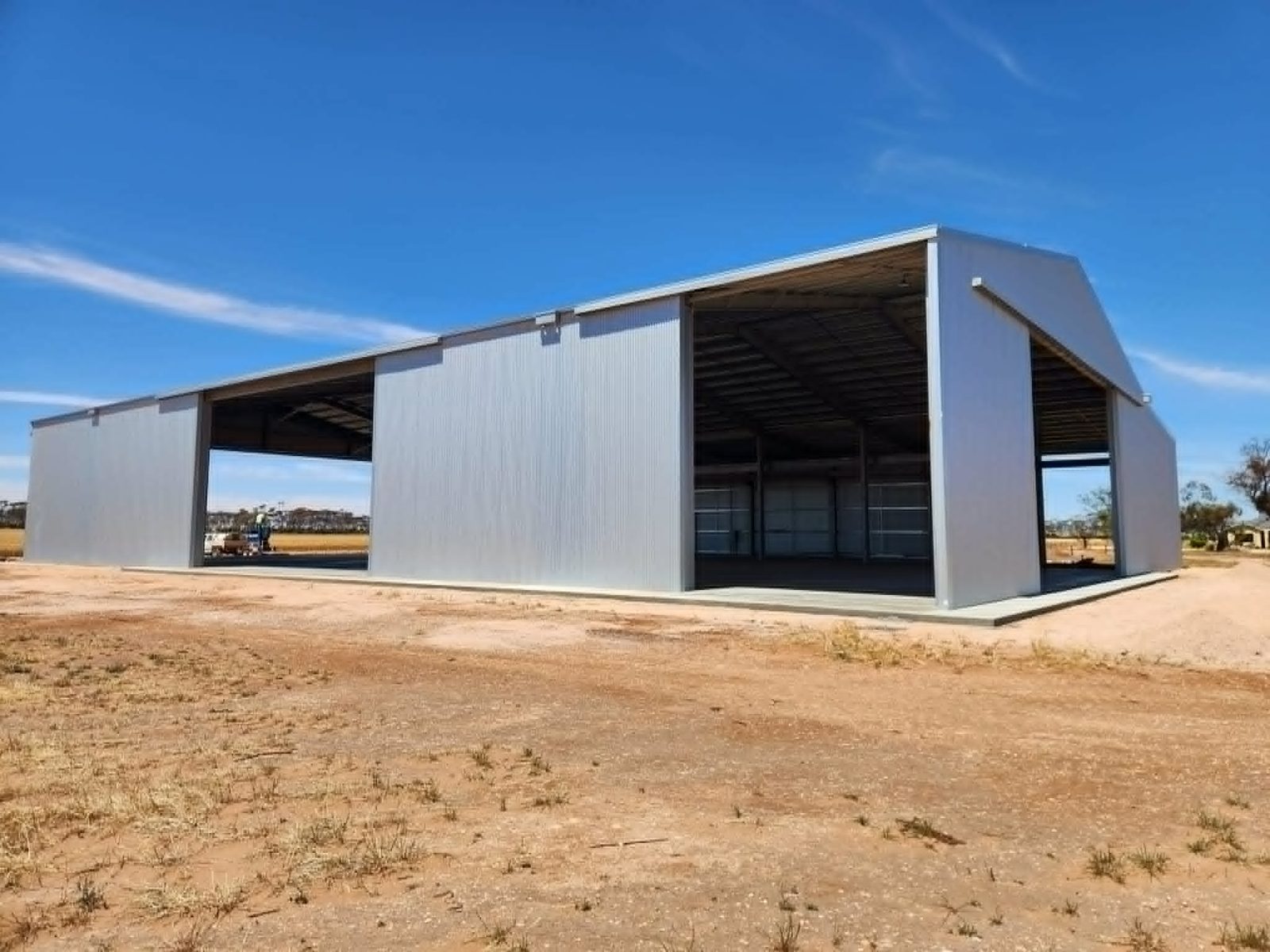 Large industrial steel shed with open bays built by Trevarth Garages
