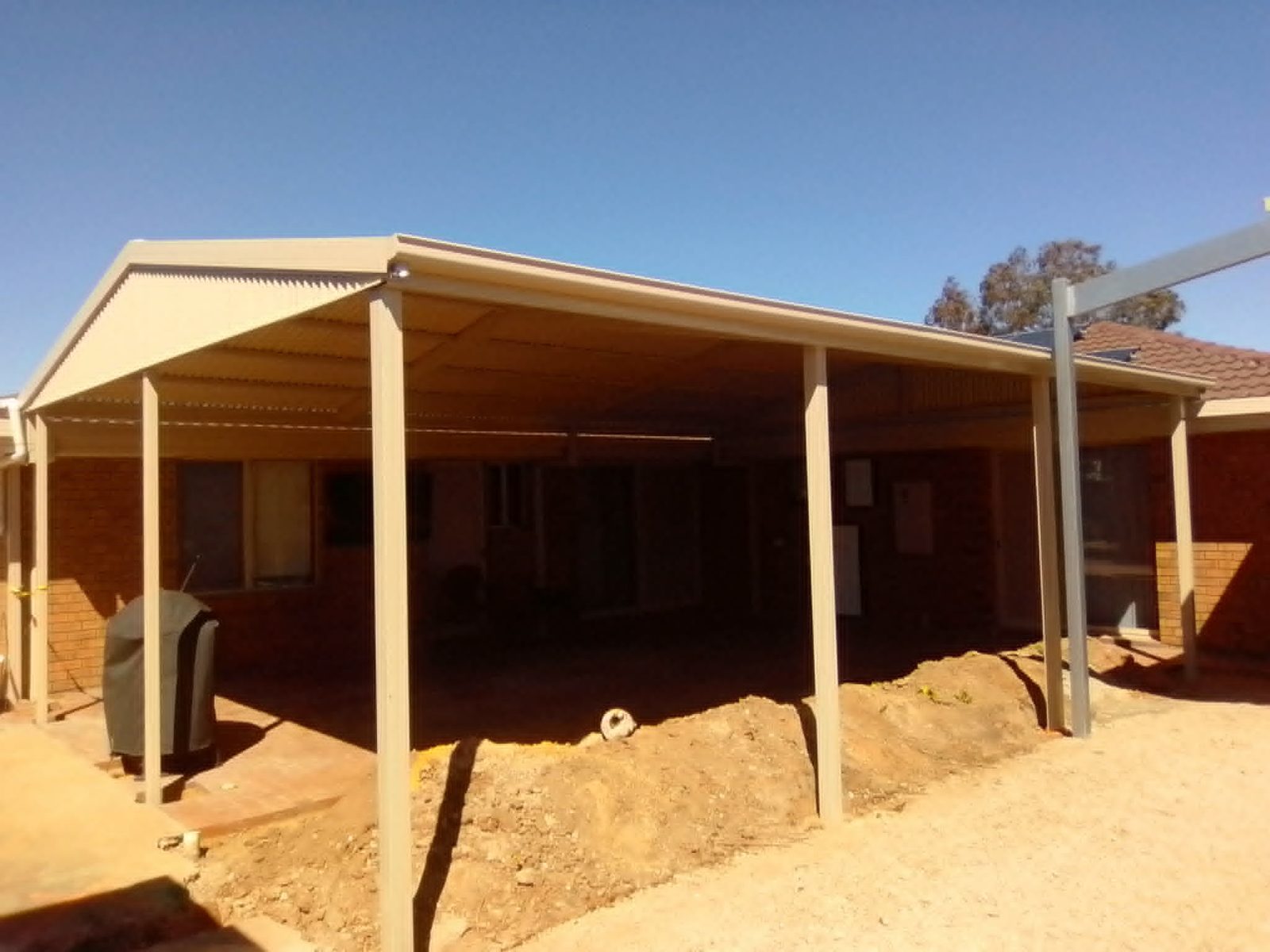 Verandah with timber-look posts built by Trevarth Garages
